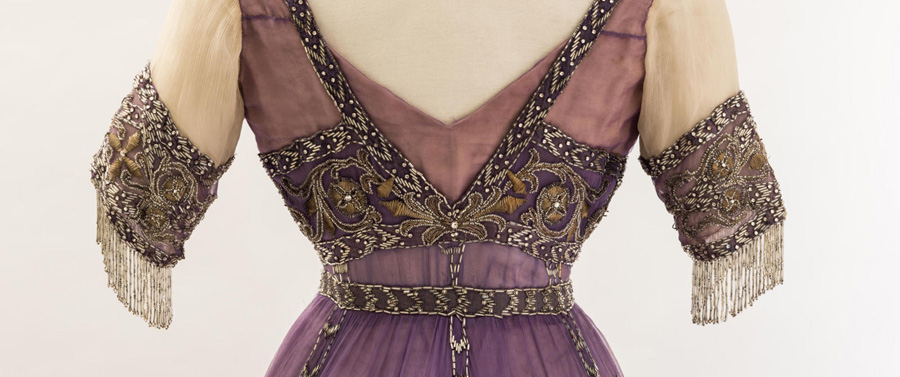 Queen Alexandra‘s mauve silk chiffon embroidered dress at the Fashion Museum