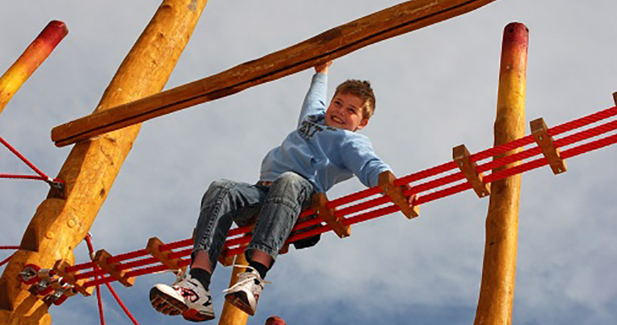 Young boy on a climbing frame at Kilkenny Lane Country Park