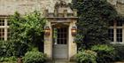 Leafy foliage surrounds the entrance to The Pig - in the Cotswolds